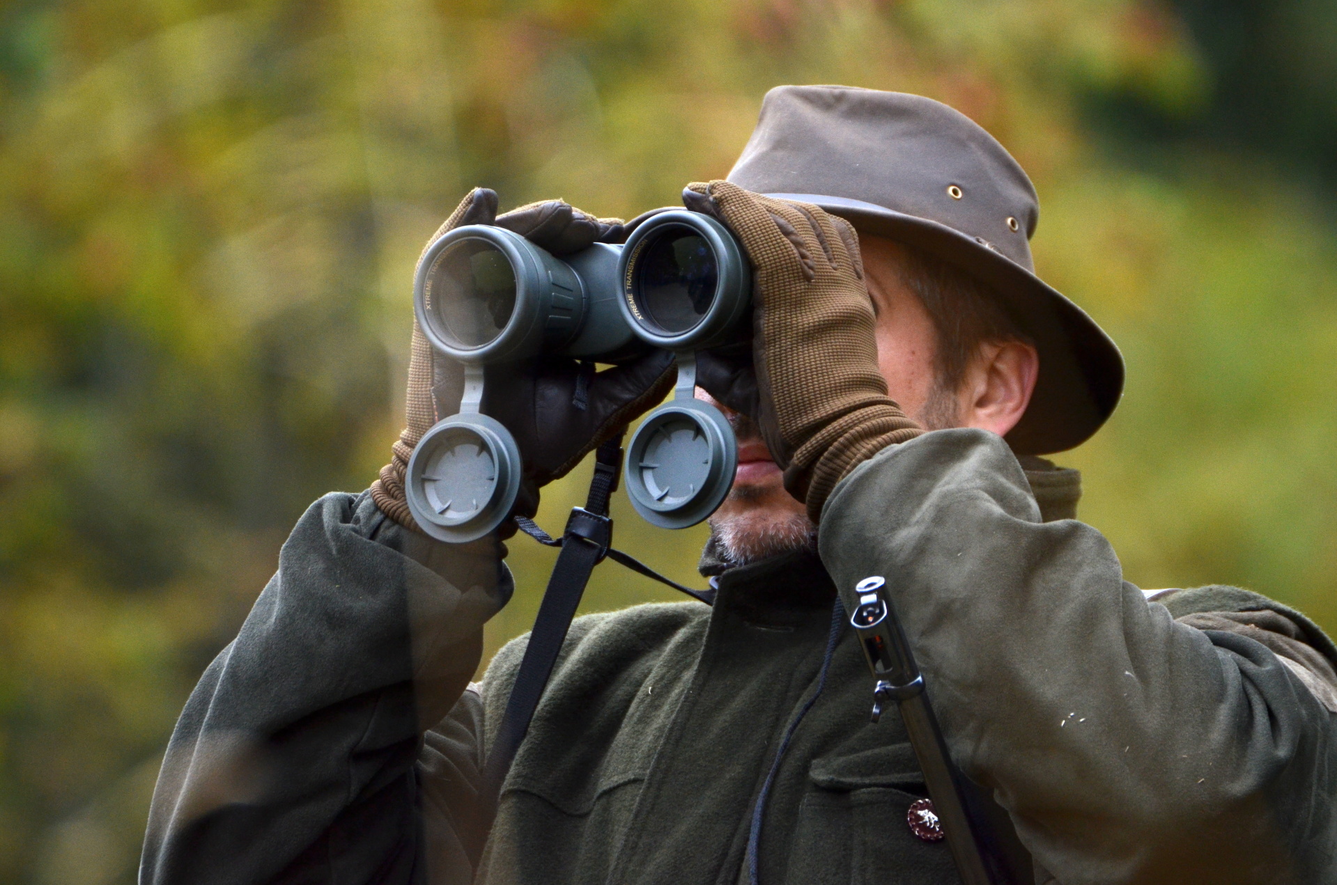 hunter looking through binoculars
